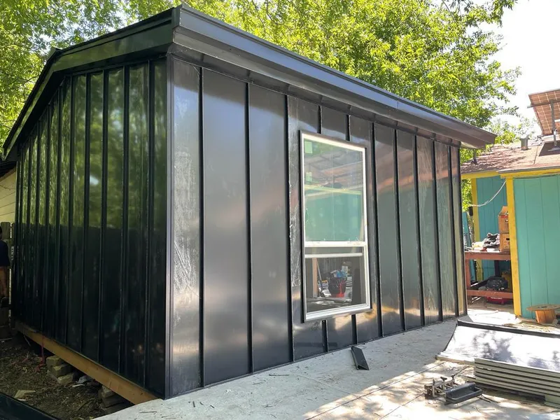 Black standing seam metal wall panels for Roof Inspection in Independent Hill